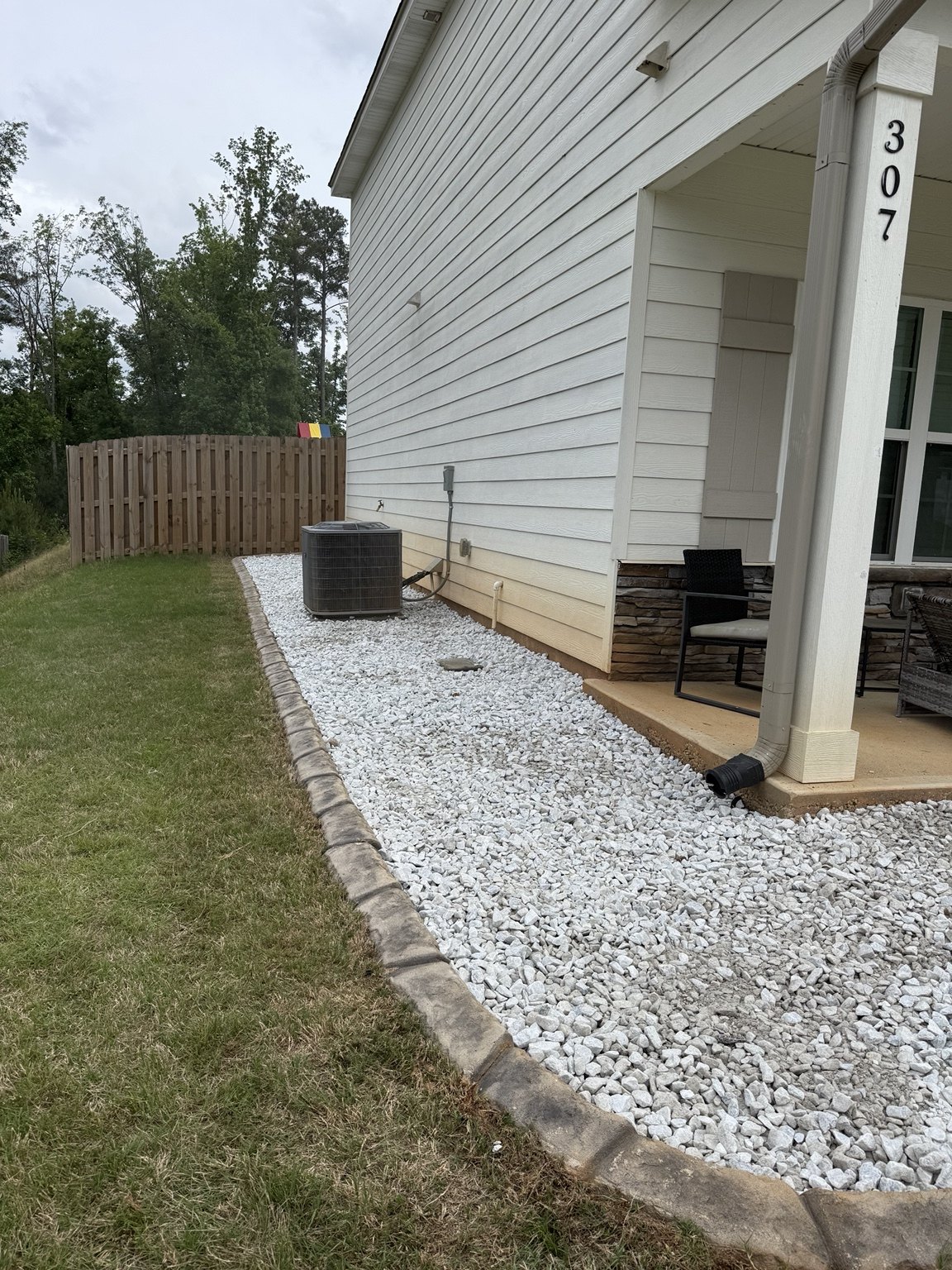 Rock installation along side of house